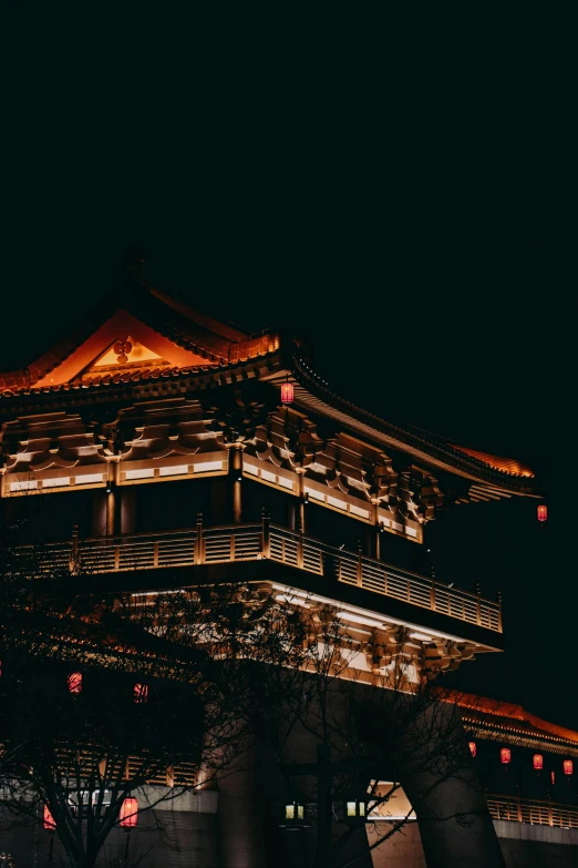 a dark night at the oriental structure that resembles a chinese pagoda