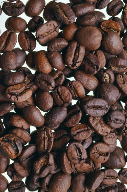 a close up of roasted coffee beans