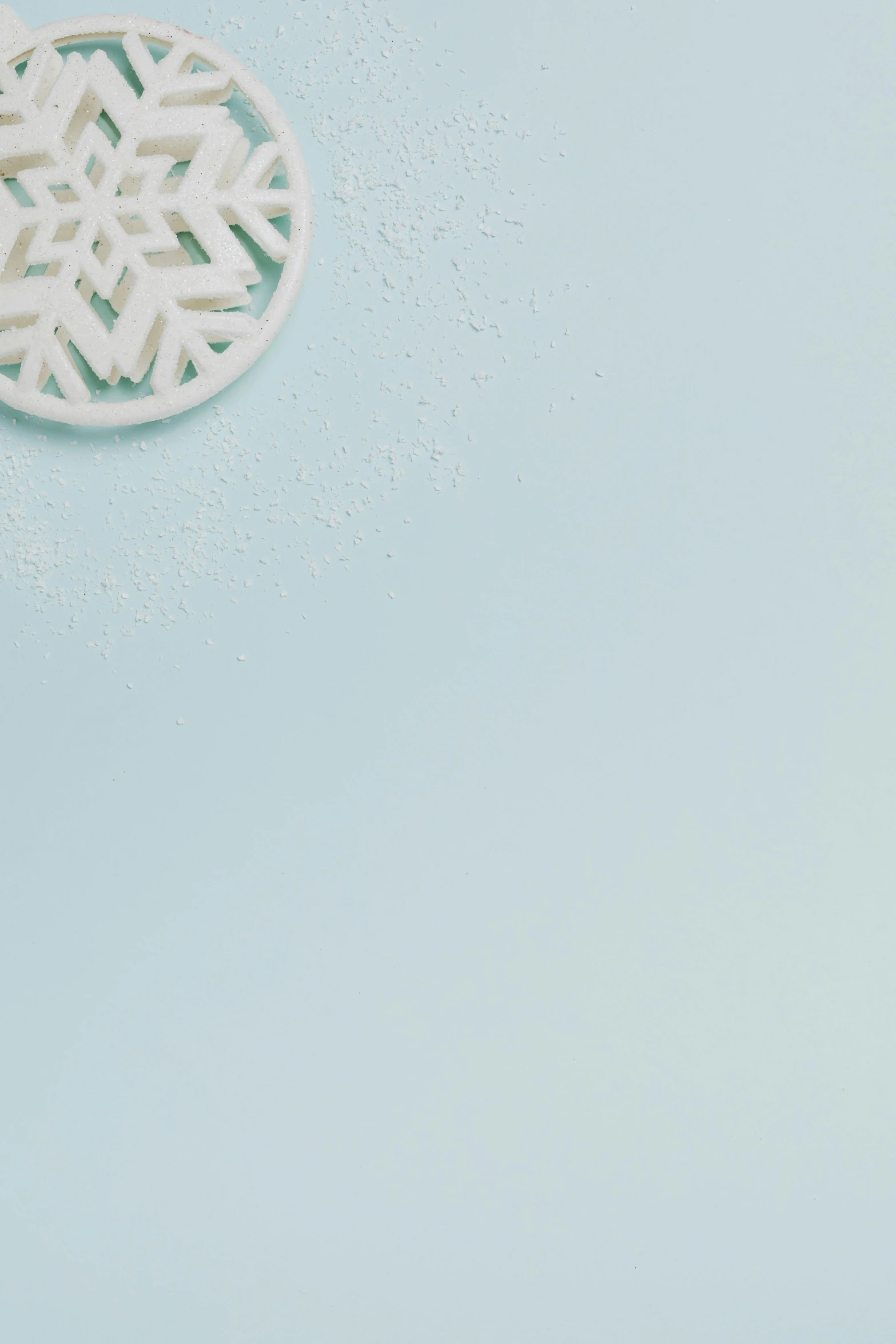 an empty paper plate that is on a blue surface