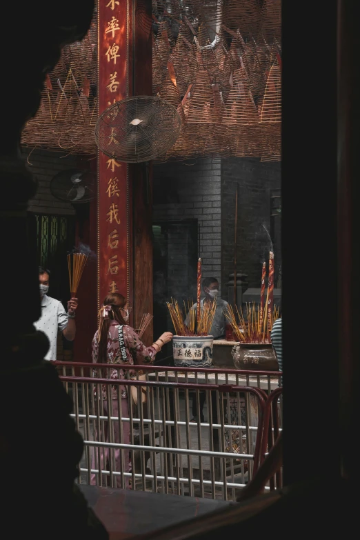 two people in front of a counter at a chinese restaurant