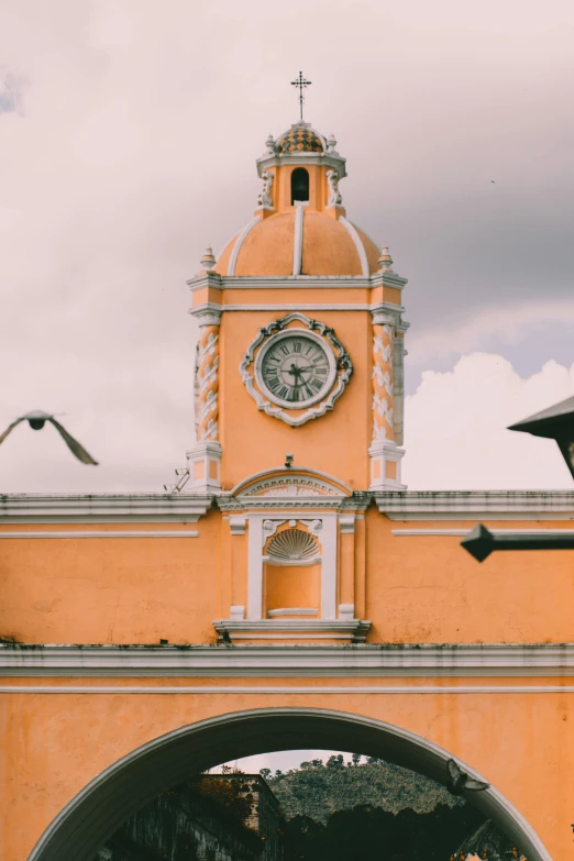 a building with a clock tower in the background