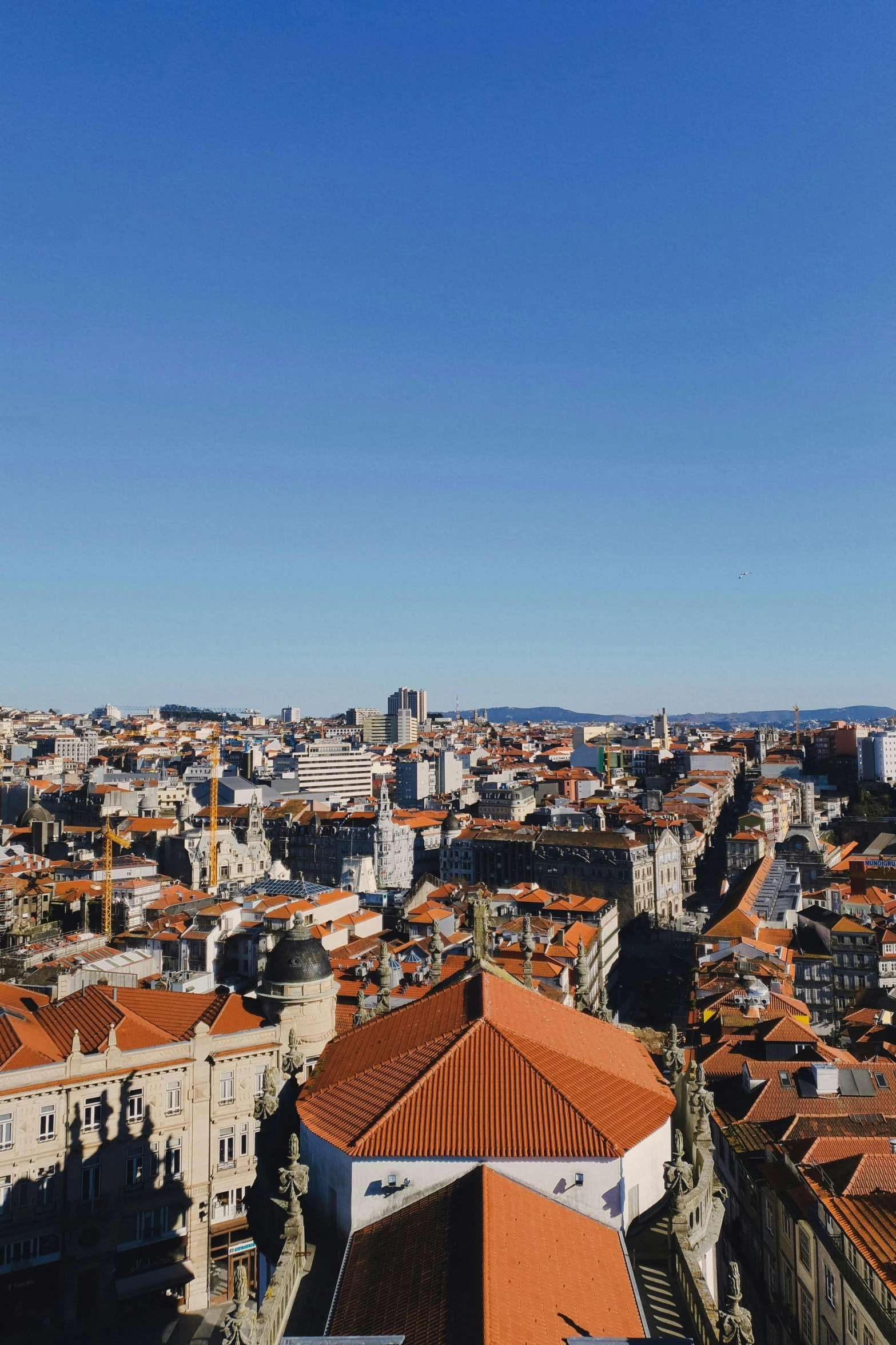 a view of some buildings in the middle of a town