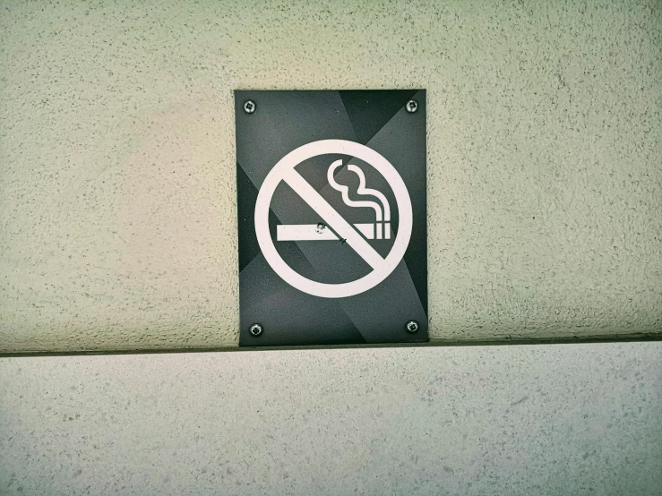 a black and white sign that says no smoking
