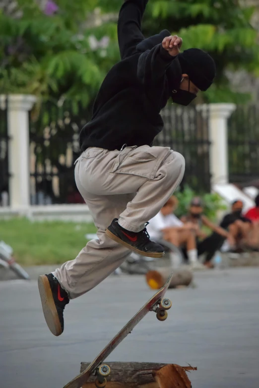 the boy is practicing his tricks on his skateboard