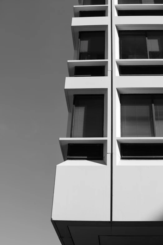 black and white pograph of a skyscr's front windows