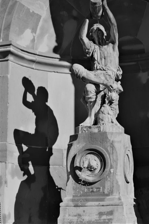 a statue is shown next to a building