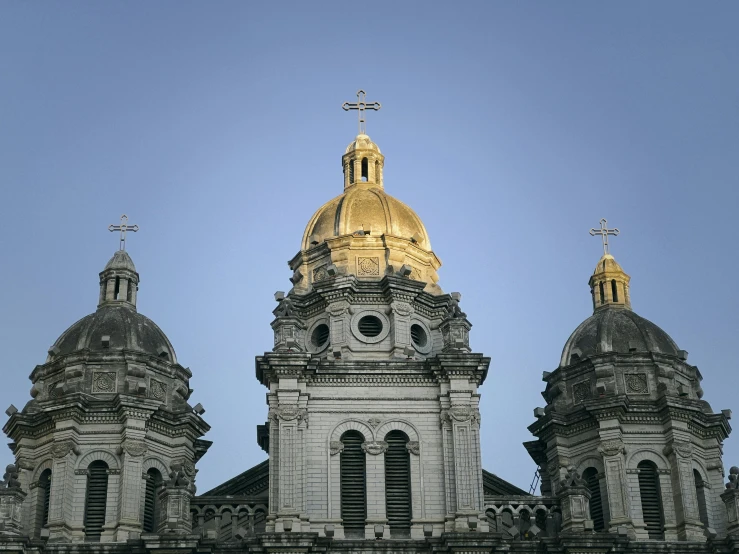 a church in a city under a blue sky