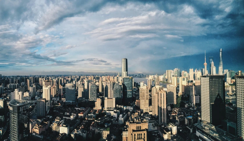 city skyline with high rise buildings and storm clouds