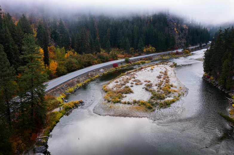 the aerial view of a river and the road