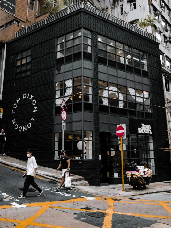 a building with a clock on the front and side of it