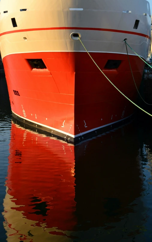 a white and red boat in the water