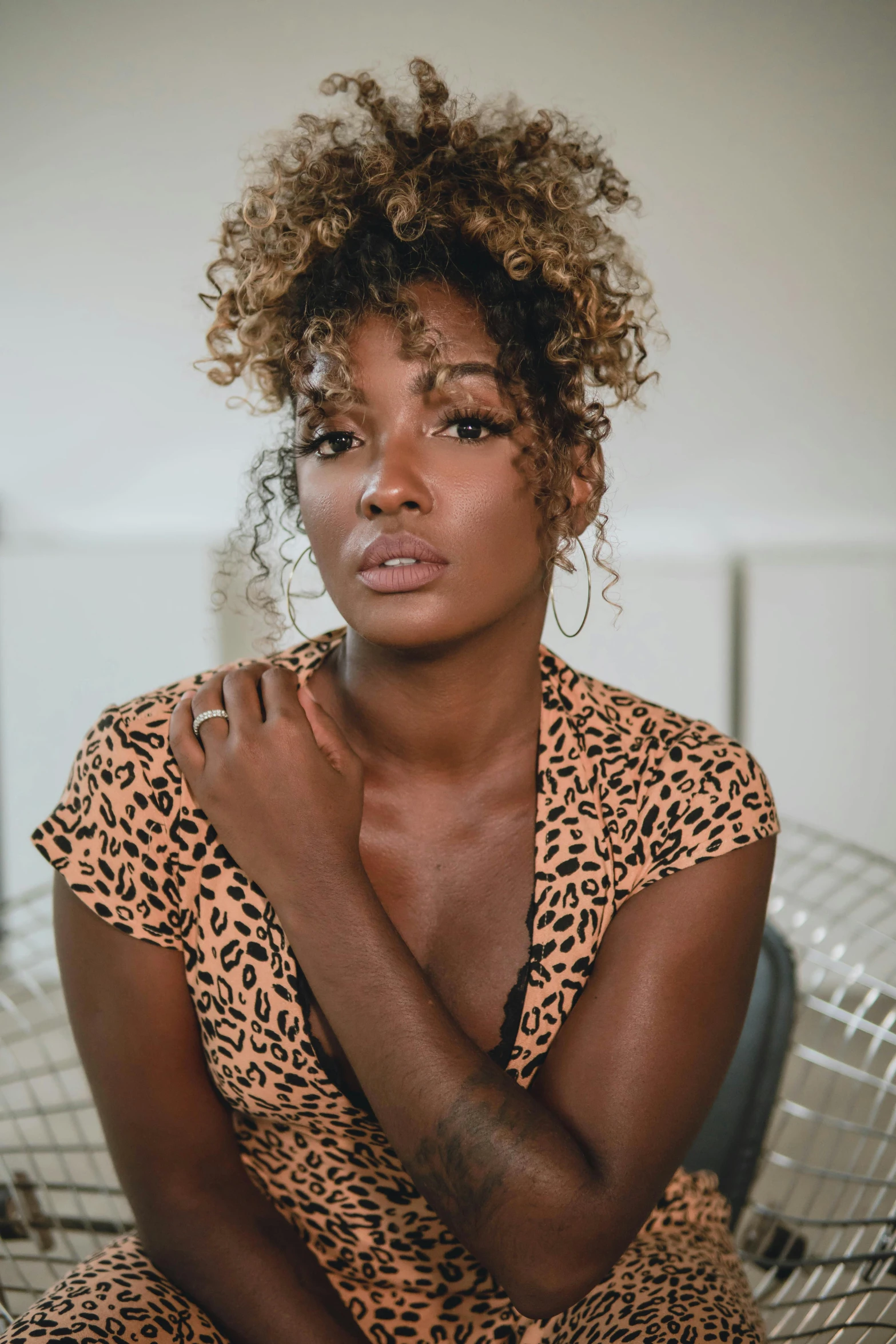 a beautiful young woman in a leopard print dress