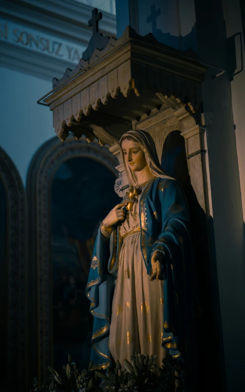 a statue of a woman dressed in blue