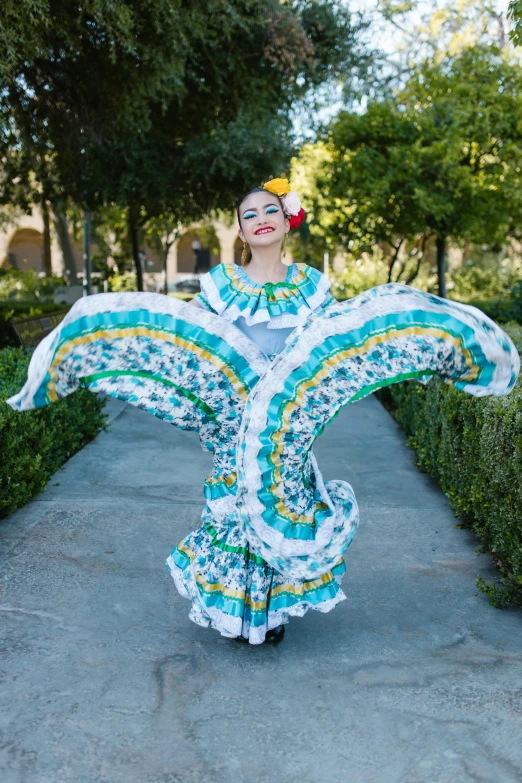 a woman in a long dress is posing for a po