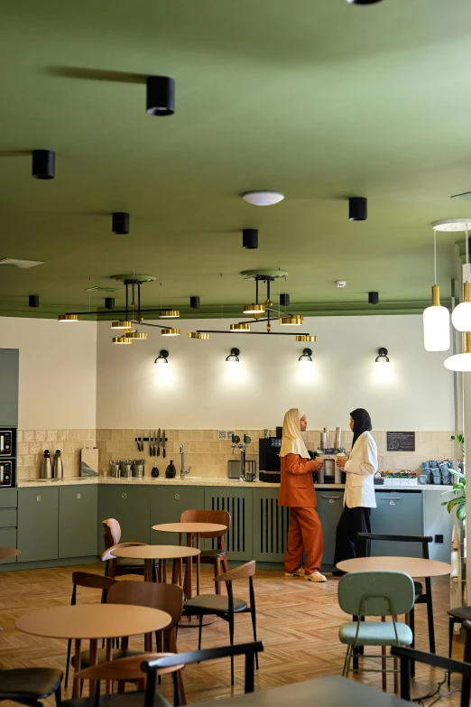 two women are working in the cafeteria