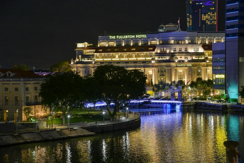 a view of a city from across the river at night