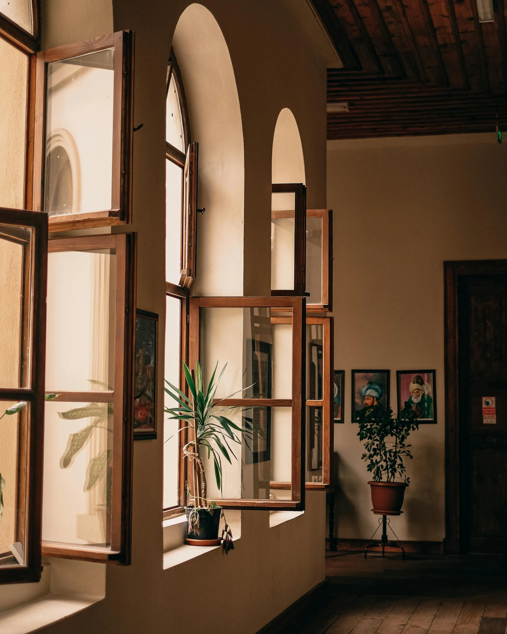 a living room with several windows in each corner