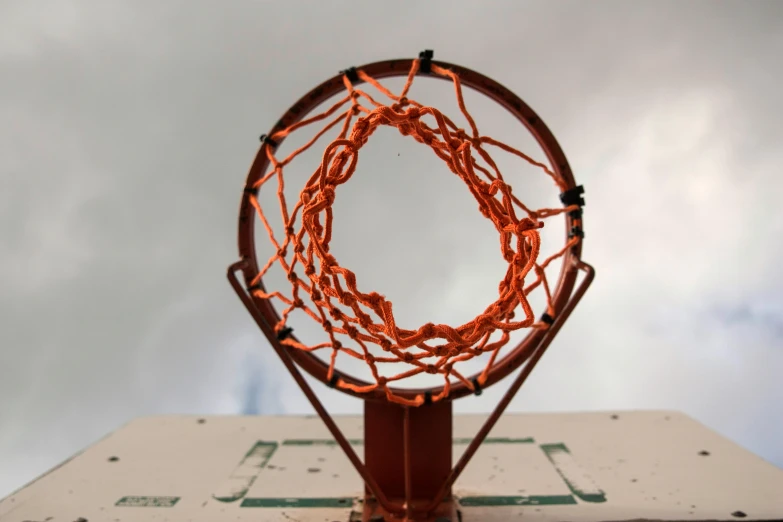 a basketball hoop is connected with red cords