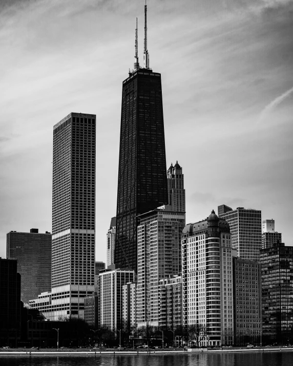 a very tall building with a tower that is in a city