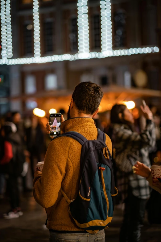 a person taking a po of lights on their cell phone