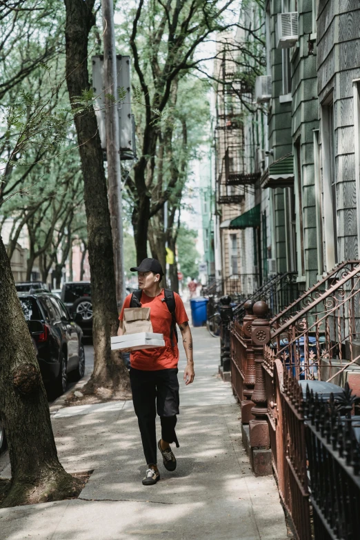 the man carries an item on his back