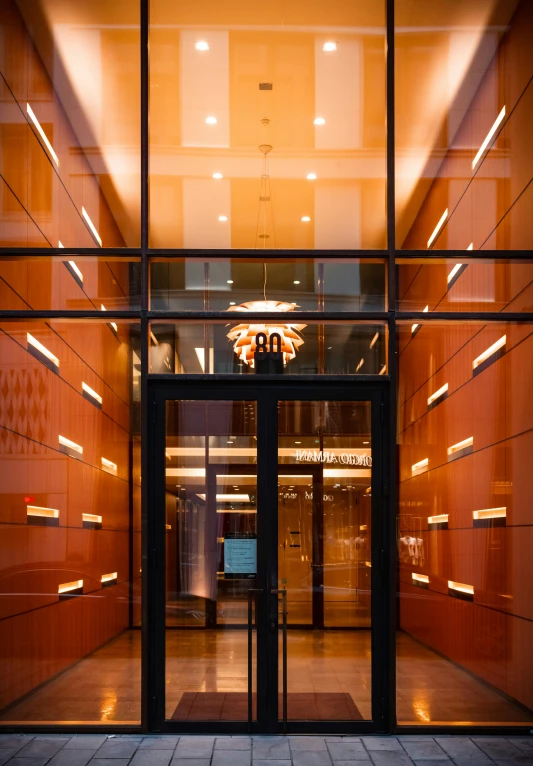 large building with a glass door and a chandelier