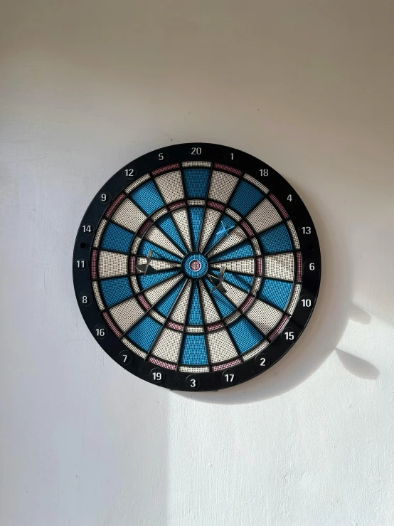 a dart hitting on the wall with darts