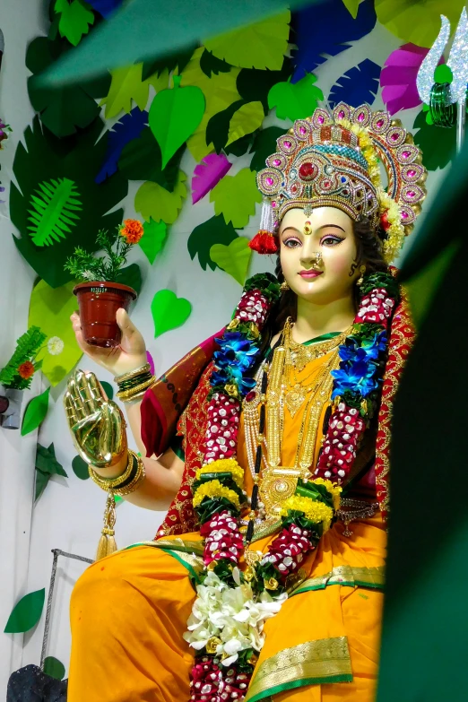 an image of a statue with potted plants