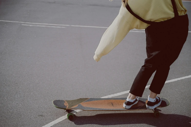 someone is riding their skateboard across the street