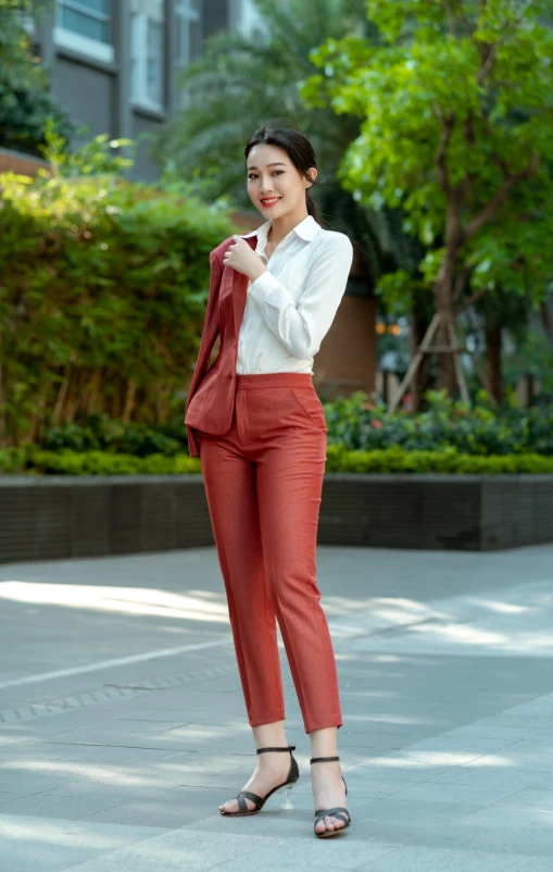 a woman posing outside in her pants