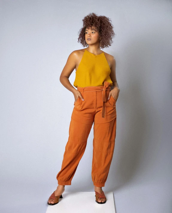 woman in an orange pants with yellow shirt