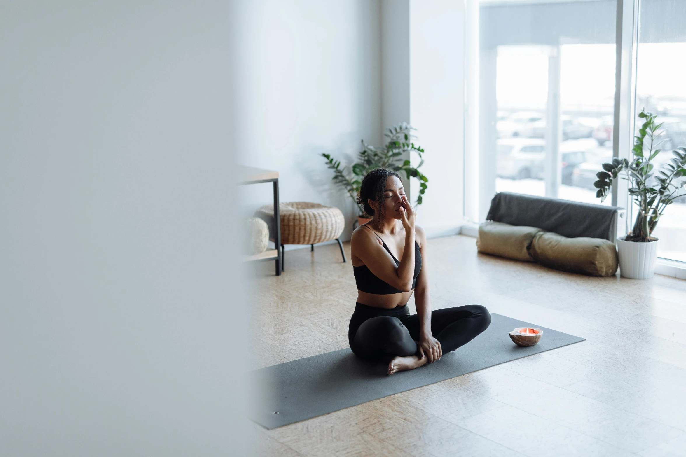 woman on her yoga mat listening to music