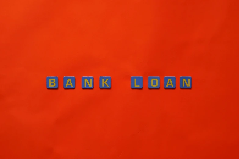 wooden type blocks spell out the word bank loan