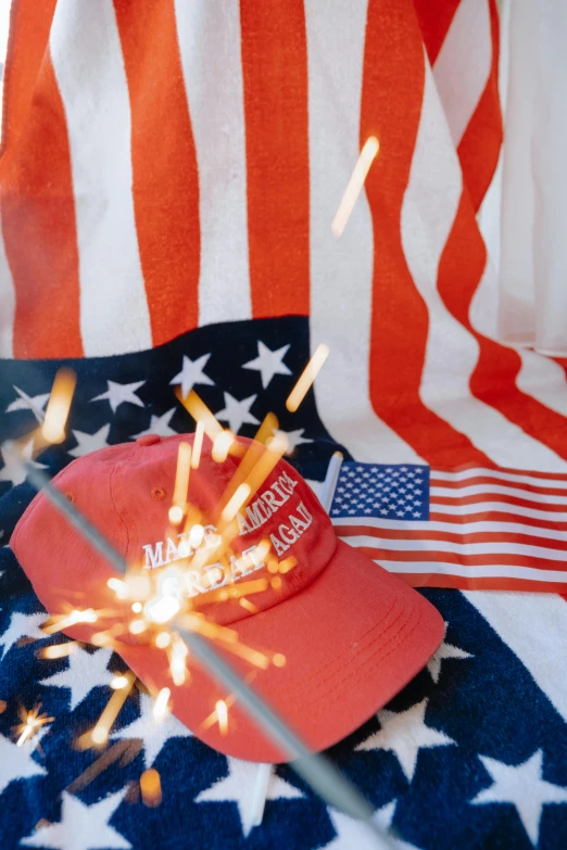 this hat has fireworks coming from it and on top of the flag