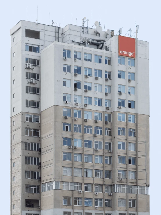 a very large building that has some windows and a banner on top