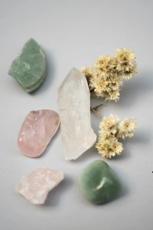 several rocks and pieces of colored clay on a table