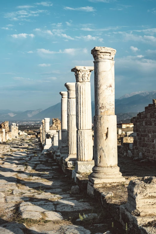 an old ruins with several stone columns