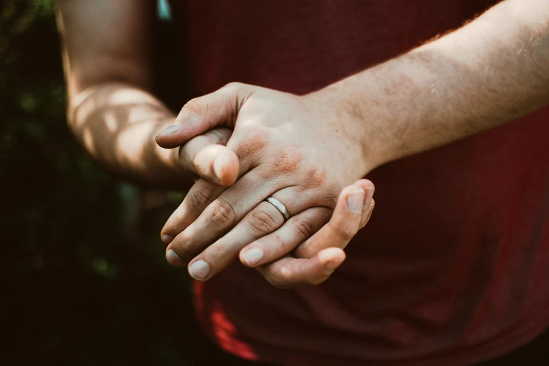 a man and a woman are holding hands