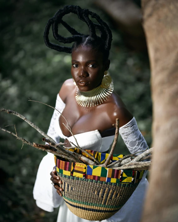 a woman with a head piece and dress holding a basket