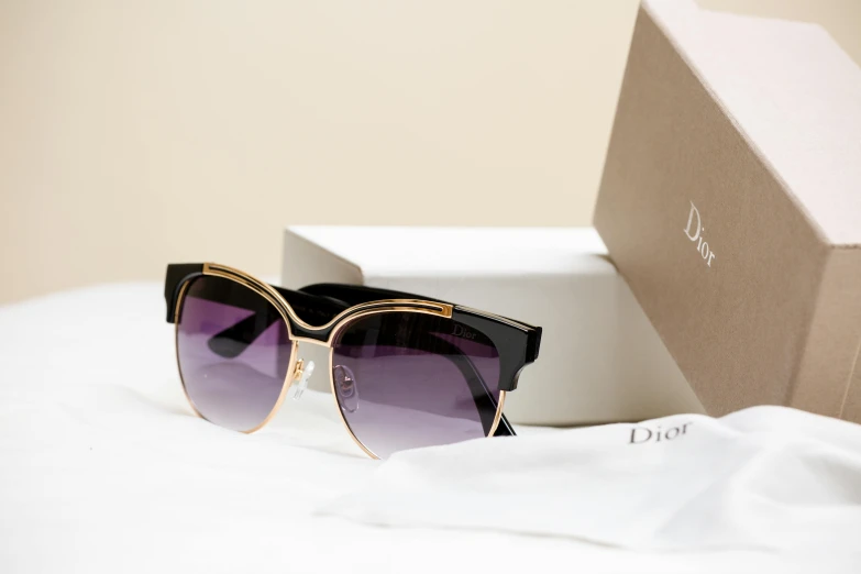 a close up of two pairs of sunglasses in a box