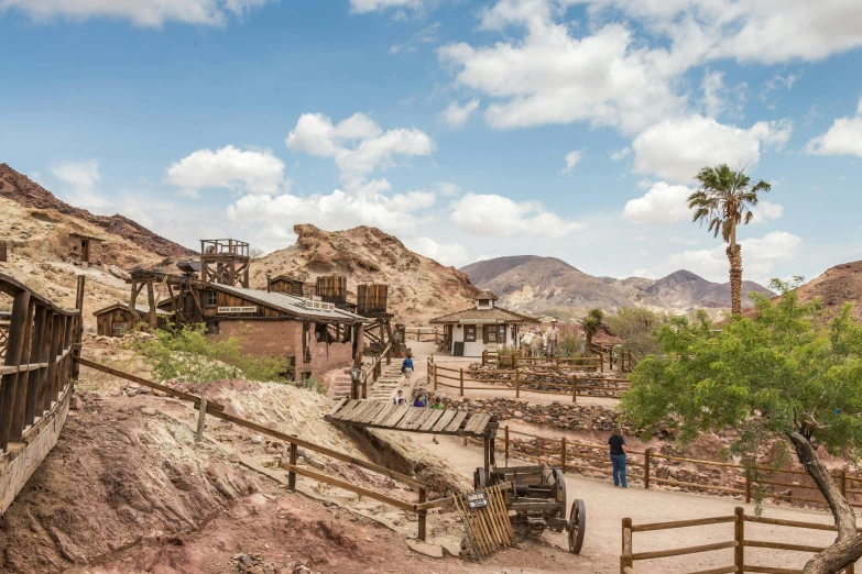 an old, deserted desert village sits amid the mountains