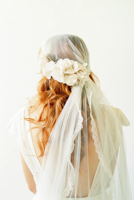 the veil on a head of a lady, made from tulle de romaine