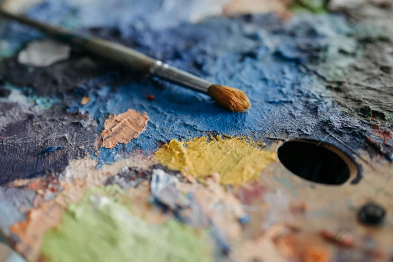 a close up view of the colors of an oil brush on a palette