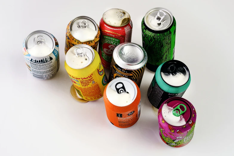 several cans of drinks next to each other on a table