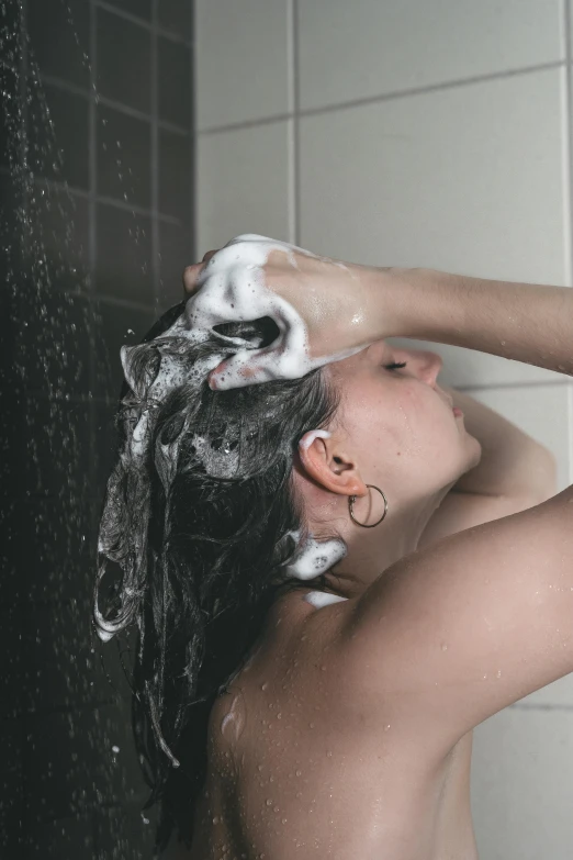 a boy is getting ready to wash his hair