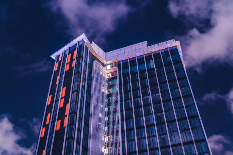 a big building is lit up at night