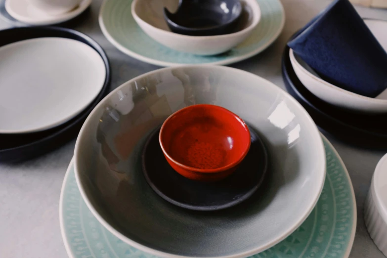 a close up of a table setting with plates