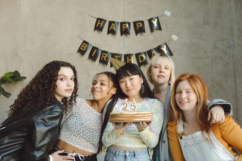 a group of girls that are standing next to each other