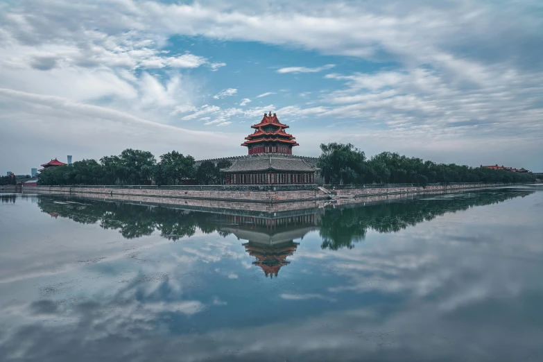 a view of a small tower across the water