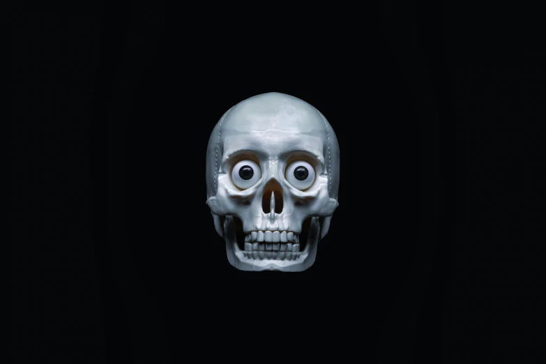 a skull is sitting in the middle of a black background